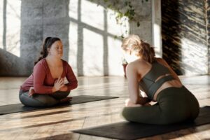 women meditating together